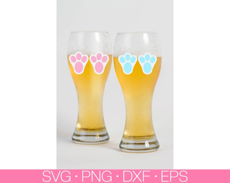 May include: Two clear glass beer mugs with pink and blue bunny paw prints on them. The mugs are filled with a light yellow beer.