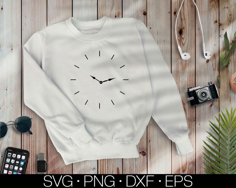 May include: White sweatshirt with a black clock design on the front. The clock has a simple design with black hands and numbers.