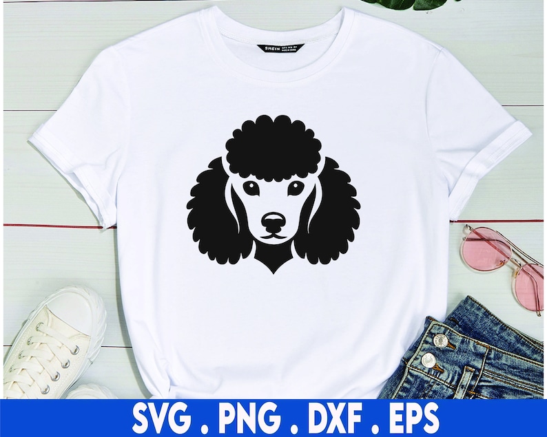 May include: A white t-shirt with a black silhouette of a poodle's head on the front.