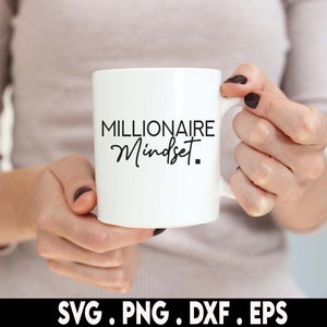 May include: White ceramic mug with black text that reads "Millionaire Mindset".