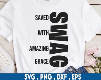 May include: White t-shirt with black text that reads "Saved with Amazing Grace" and "Swag" vertically down the side.