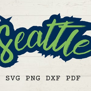 May include: Green text that says "Seattle" in a brush stroke font. The text is outlined in dark blue.
