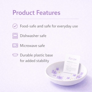 May include: A white bowl with purple floral patterns and a small card labeled Recipe. Text lists product features: Food-safe and safe for everyday use, Dishwasher safe, Microwave safe, and Durable plastic base for added stability.