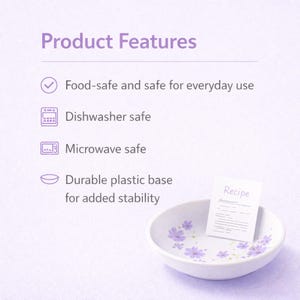 May include: A white bowl with purple floral patterns and a small card labeled Recipe. Text lists product features: Food-safe and safe for everyday use, Dishwasher safe, Microwave safe, and Durable plastic base for added stability.