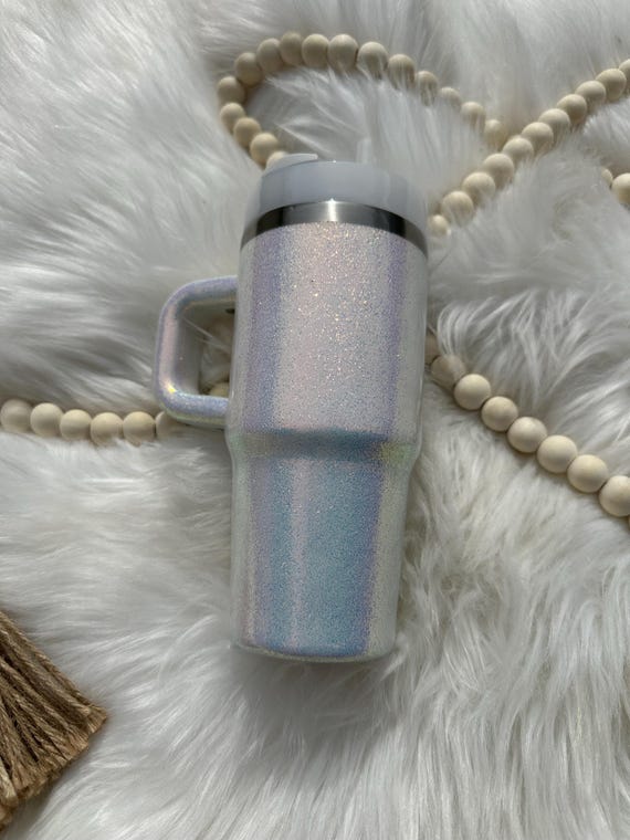 Authentic Stanley tumbler with iridescent opal color shift glitter added to the frost Stanley. Made to order