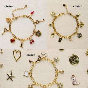 May include: Three gold charm bracelets with various charms, including stars, hearts, keys, and a cowboy boot. One bracelet has a martini glass charm. The bracelets are displayed on a neutral surface.