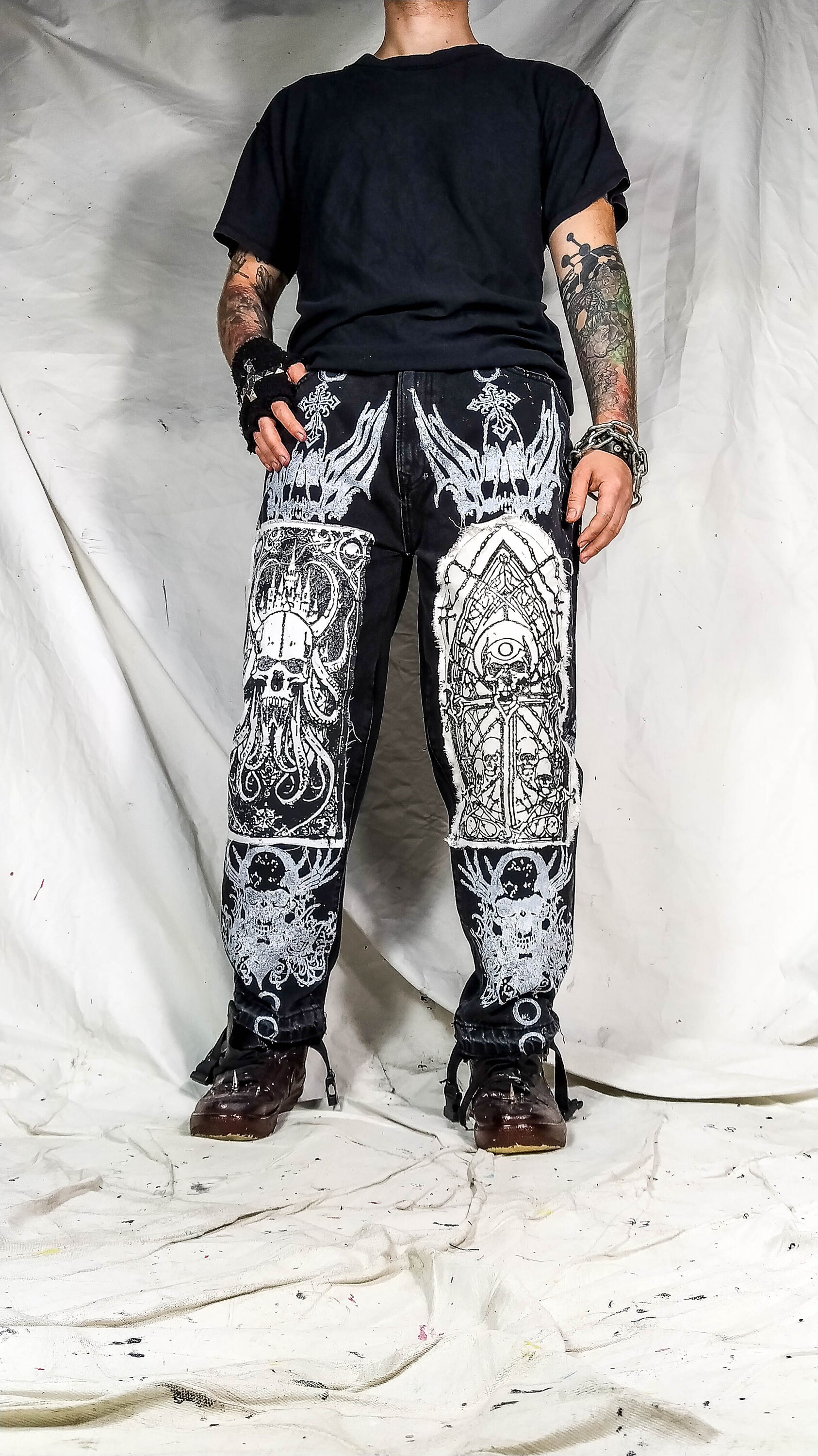 Black jeans with white paint best sale