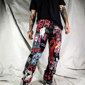 Model showing a custom made black pair with prints containing various horror movies, red and black patchwork, abstract painting, studs, red laces hanging down, chain and eyelets.