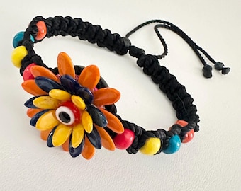 Pulsera-Artesanal-Hecha mit Cuentas de Madera Hilo Espinga-Tiene-Uni-Flor-muy Colorida-Como Hauptfarbe