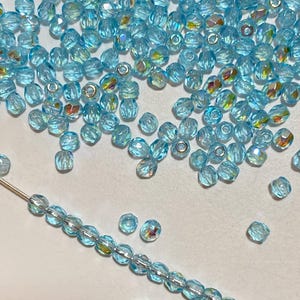 3mm fire polish bead, light blue baby blue transparent AB, genuine Czech glass, set of 50 beads