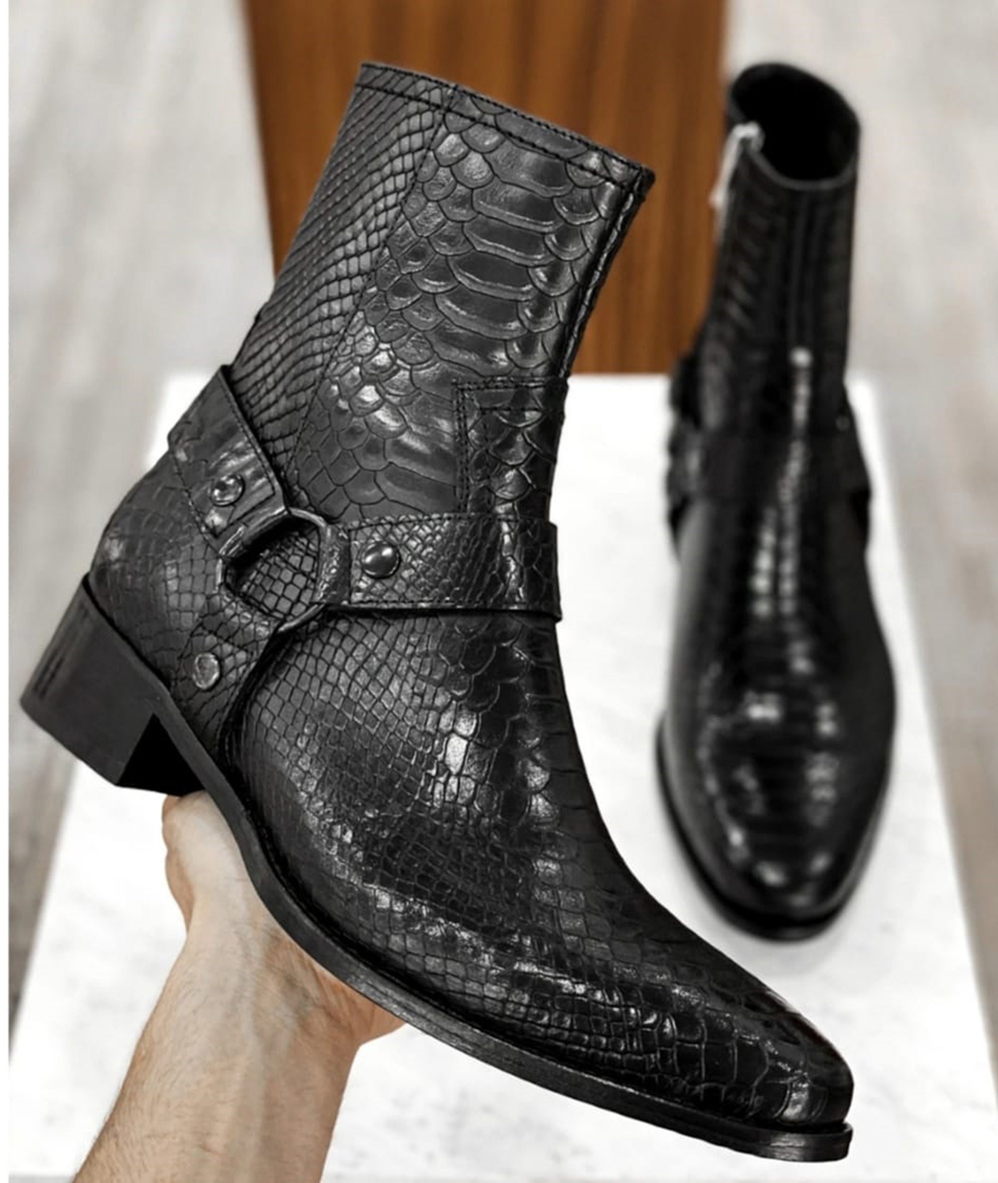 Engraved black python leather boots