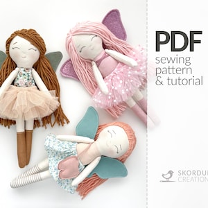 May include: Three handmade fairy dolls with wings, tulle skirts, and long hair. The dolls are pink, brown, and peach. The image includes the text "PDF sewing pattern & tutorial" and "Skorduli Creations".