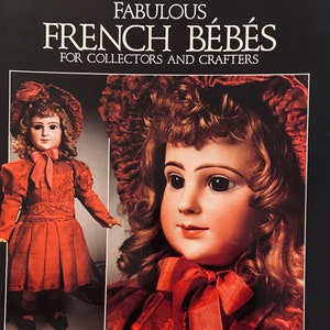 May include: Book cover featuring a vintage doll with a red dress and hat. The title reads "Fabulous French Bébés" by Mildred Seeley, with text "For Collectors and Crafters." The Scott Publications logo is visible.