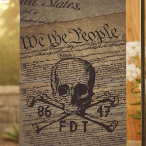 May include: A garden flag featuring a skull and crossbones design over a vintage parchment background. The flag displays the text "We the People" and other script, with the numbers "86" and "47" and the letters "FDT" below the skull.