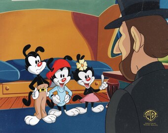 May include: Three cartoon characters, two with black and white fur and one with red and white fur, stand in front of a man wearing a top hat and a black suit. The characters are smiling and looking at the man. The background is a colorful living room setting.