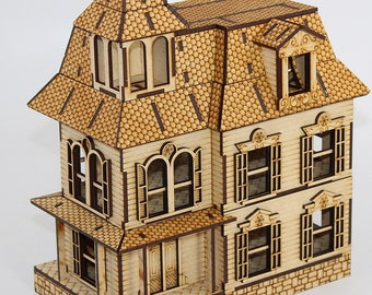 May include: A wooden model of a Victorian-style house with a brown roof, white walls, and black windows. The house has a porch with steps leading up to the front door. The model is detailed with intricate trim and decorative elements.