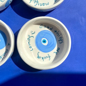 Happy handmade ceramic evil eye bowl