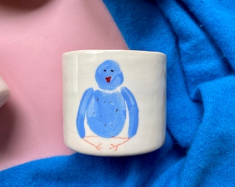 Handmade ceramic blue bird mug meditating
