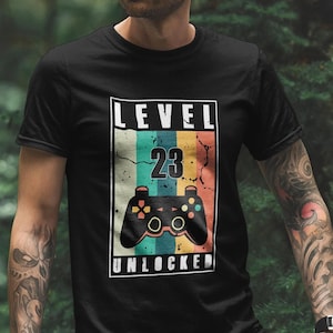 Gamer 23rd Birthday Shirt. 23rd birthday gift for him & her. 2000 Birthday.. Men&#39;s and Women&#39;s 23rd Birthday Gift. 23rd Birthday Graphic Tee