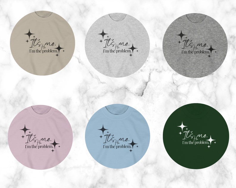 May include: Six different color t-shirts with the text "It's me. I'm the problem." printed on them. The text is in black and the shirts are in the colors beige, gray, light pink, light blue, dark green, and light gray.