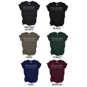 May include: A mockup of a t-shirt with the text "Dolce far niente" and the definition "The sweetness of doing nothing" in white text on a variety of colored t-shirts. The colors include vintage black, black, army, forest, navy, and maroon.