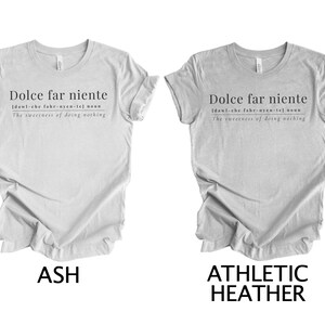 May include: Two gray t-shirts with the text "Dolce far niente" and the definition "dawl-che fahr-nyen-tel noun The sweetness of doing nothing". The t-shirts are shown in two different colors: ash and athletic heather.