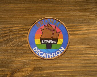 Activision Decathlon Bronze version patch style image on a Fridge Magnet 3" Round Metal Plate - High gloss - Image sublimated into plate