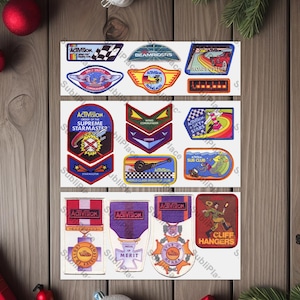 May include: A set of nine vintage Activision video game patches. The patches are colorful and feature various designs, including a spaceship, a submarine, a race car, and a skydiver. The patches are all rectangular and have a white border. The patches are arranged in three rows of three. The patches are all in good condition.