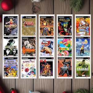May include: A collection of retro video game cases, including titles like "Zelda", "Soul Calibur", "Super Smash Bros", and "Metal Gear Solid 3". The game cases are arranged on a wooden surface, with Christmas decorations in the background.