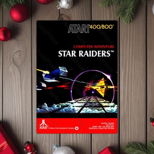 May include: A black Atari 400/800 Star Raiders game box. The box features a space scene with a spaceship, a geometric shape, and the game's title. The Atari logo is at the bottom.