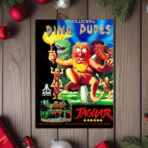 May include: A retro video game cartridge featuring the game "Evolution Dino Dudes" for the Atari Jaguar. The artwork depicts cartoon cavemen, a dinosaur, and an elephant. The cartridge has a black background with the game title in blue and red.