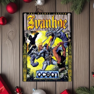 May include: A rectangular sign featuring the text "Ivanhoe" in yellow and a fantasy illustration of a knight battling a dragon. The sign also includes the text "The Mighty Legend" and the "Ocean" logo. The sign is surrounded by Christmas decorations.