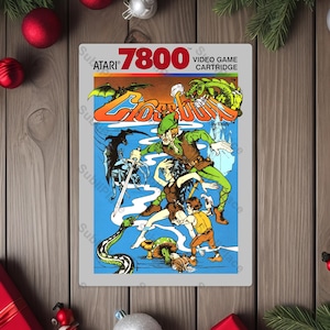 May include: Atari 7800 video game cartridge featuring the game title "Cloudborn". The cartridge art depicts a fantasy scene with characters in action, including a green dragon and a sword-wielding figure. The background is blue.