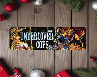 Undercover Cops Arcade Game Marquee image on a 4"x13.5" Metal Plate - High gloss with rounded corners - Image is sublimated into the metal
