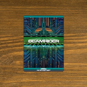 May include: A rectangular Atari 2600 game cartridge with a vibrant, futuristic design. The cartridge features a teal and green circuit board-like pattern with the word "BEAMRIDER" in large, white letters. The Activision logo is at the bottom.