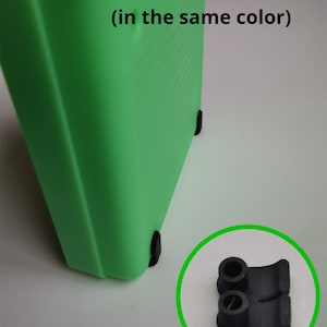 May include: A close-up of a bright green plastic object with integrated black feet. The text "Integrated feet ADDON (in the same color)" is visible. A detached black foot is shown in a green circle.