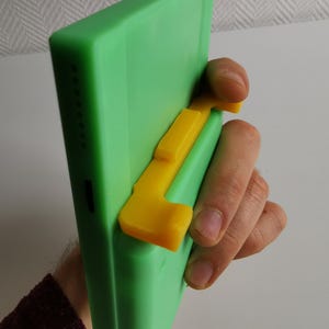 Analogue® Pocket® カートリッジスロットの改良されたショルダーボタンとダストカバー