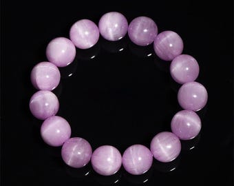 May include: A bracelet made of light purple gemstone beads. The beads are round and have a smooth, polished finish.