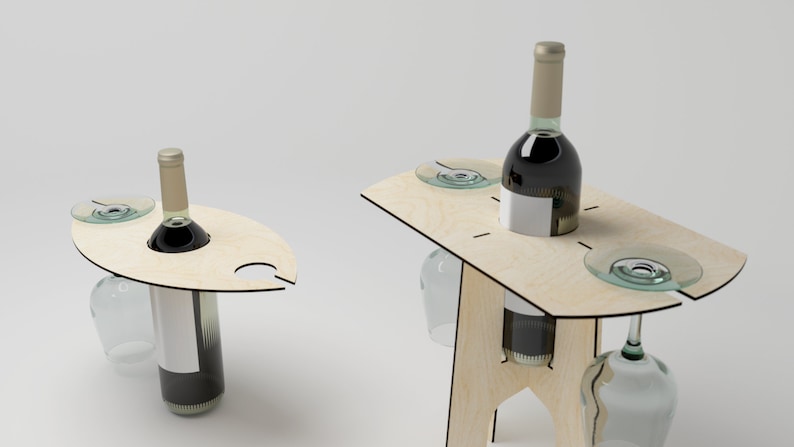 May include: Wooden wine table with a bottle of red wine, two wine glasses, and a small plate. The table has a unique design with a cutout for the wine bottle and a slot for the wine glass.