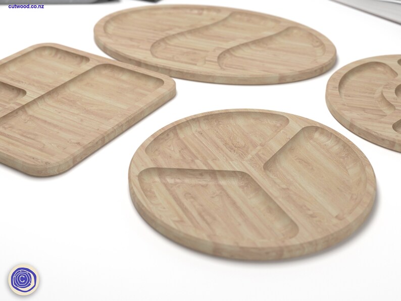 May include: Four wooden serving trays with different shapes and compartment configurations. The trays are made of light brown wood with a natural grain pattern.