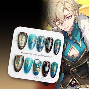 May include: A set of ten handmade nail enhancements with various designs featuring blue, green, and gold accents. The designs include glitter, geometric patterns, and intricate details. The nail enhancements are displayed on a white board with the text "Handmade nail enhancement" and size options.