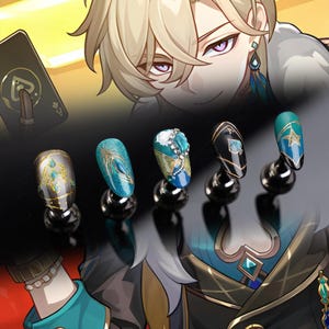 May include: Five teal blue and gold nail art designs on display stands. The designs feature a feather, a star, a spade, a jewel, and a geometric pattern.