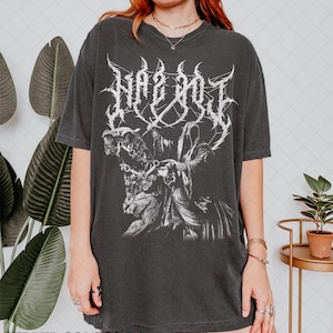 May include: Dark grey t-shirt with a white gothic graphic and the text "HAZ NO J". The design shows a horse and rider. The words "PEPPER COLORS" are printed at the bottom of the image.