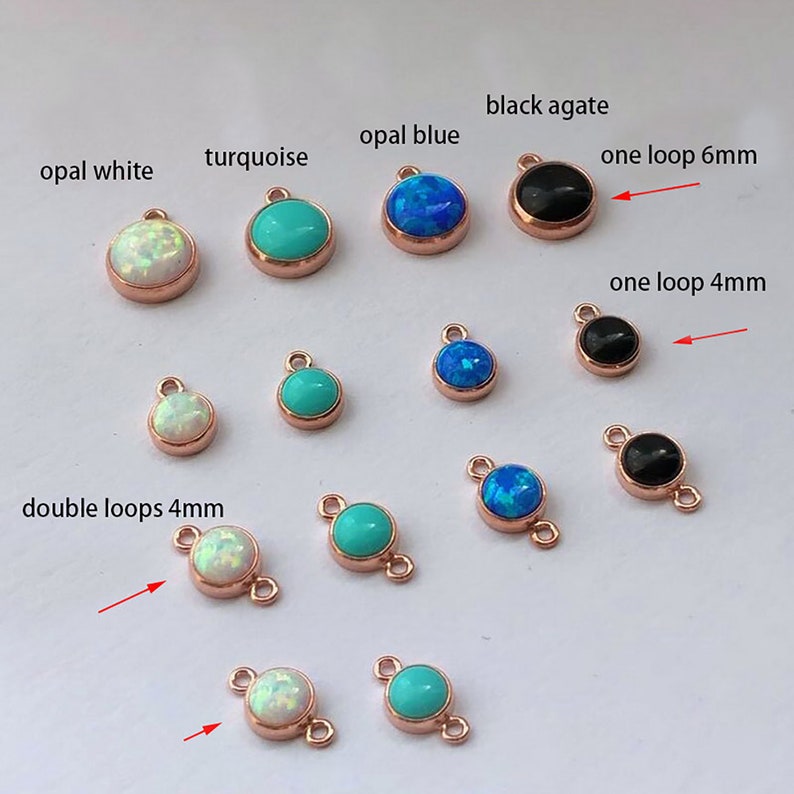 May include: Assortment of 6mm and 4mm round gemstone charms with different colors and styles, including opal white, turquoise, opal blue, black agate, and double loops. The charms are made of metal with a rose gold finish.