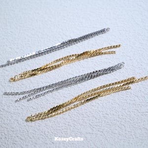 Orecchini pendenti lunghi con catena a torsione placcata oro (60 mm)