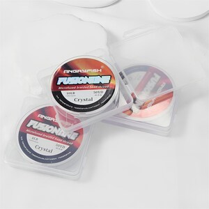 May include: Clear plastic containers holding spools of fishing line. The spools are labeled "ANGRYFISH FUSIONINE" with details including "Microfused braided bead thread," "10LB," and "50YD." The line is labeled "Crystal" and is designed for low temperature resistance and corrosion resistance.