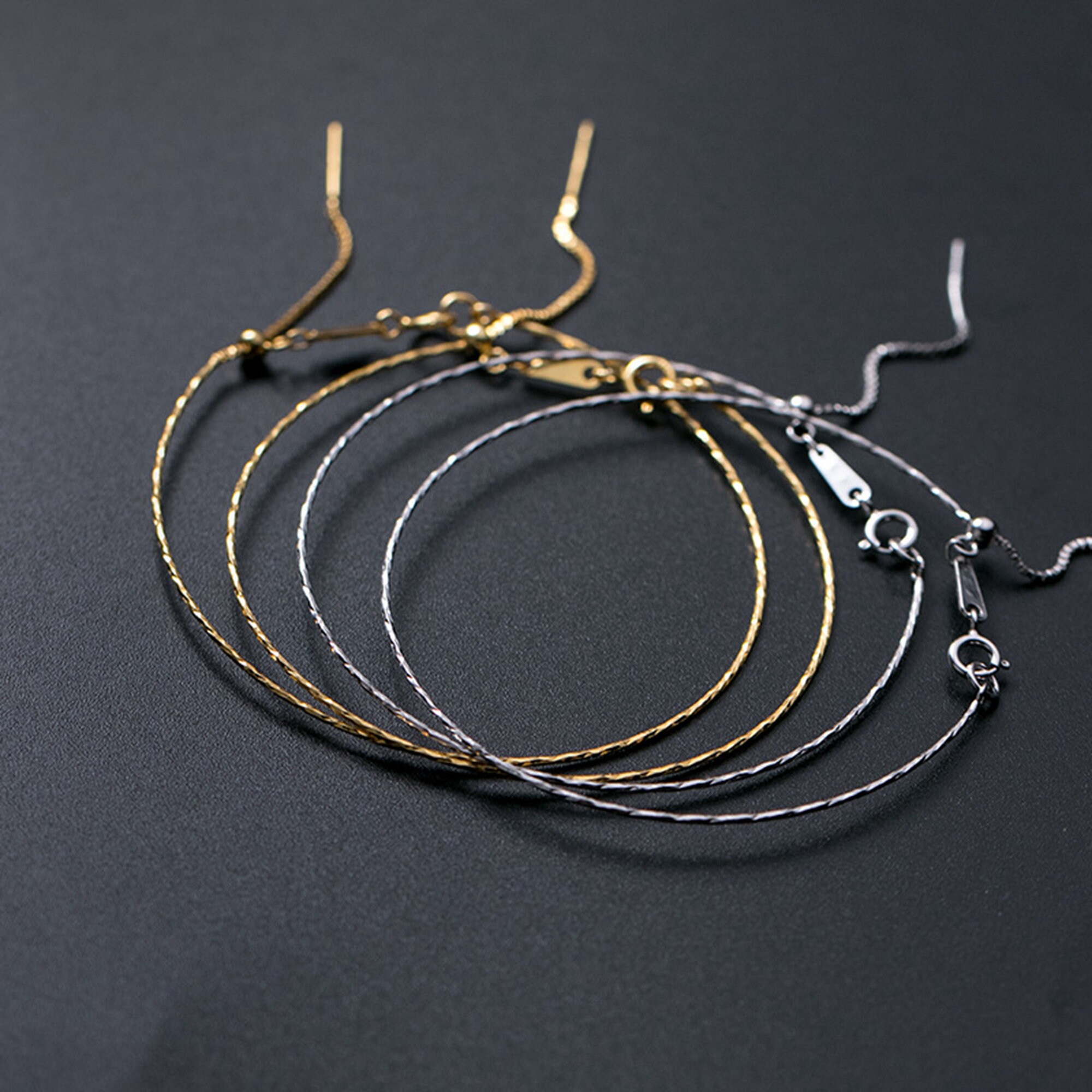 Bracciale minimal catena argento placcato oro rosa con sfere a lamelle