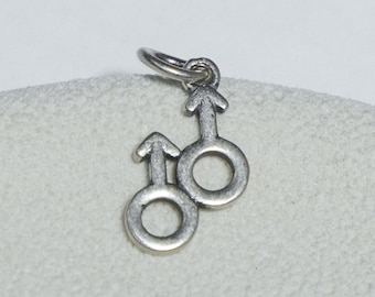 Charm de plata de ley con símbolo de género, joyería feminista