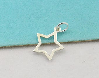 May include: A silver star charm with a loop for attaching to a necklace or bracelet.