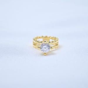 Colgante de anillo de boda de plata de ley con piedra de circonita